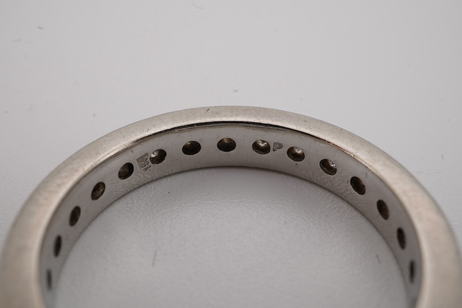 A diamond eternity ring, channel-set with a continuous band of brilliant-cut diamonds totalling approximately 1.20 carats, mounted in platinum, size P1/2, British hallmarks, Condition: good